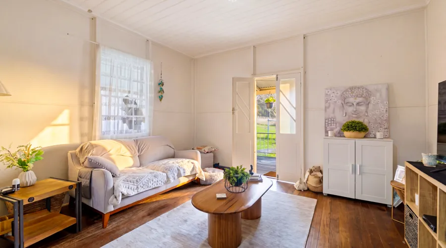 Sunlit living room with timber floors