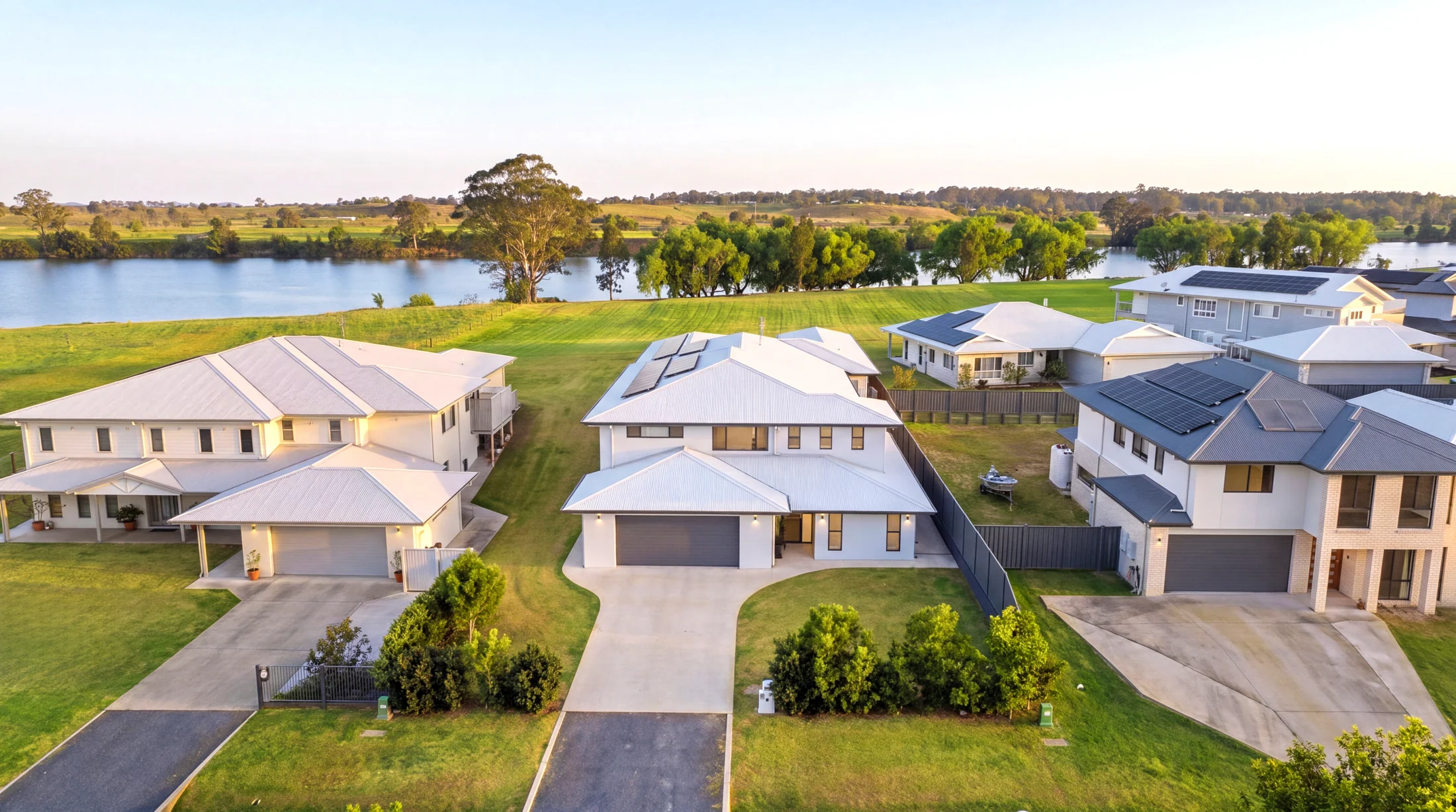 Afternoon aerial view of the front of 5 Clear Water Close with the river behind